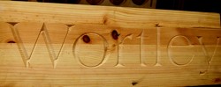 V carved text into Pine
